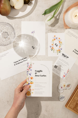 Romantic watercolor wedding invitation suite adorned with delicate floral watercolor elements and a dreamy, artistic aesthetic.