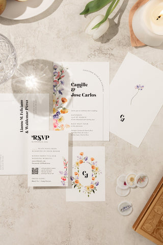 Romantic watercolor wedding invitation suite adorned with delicate floral watercolor elements and a dreamy, artistic aesthetic.