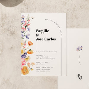 Romantic watercolor wedding invitation close-up adorned with delicate watercolor floral elements and a dreamy, artistic aesthetic.