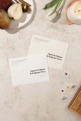 Romantic wedding printed envelopes in white and ivory, designed with minimalist elements and a dreamy, artistic aesthetic.