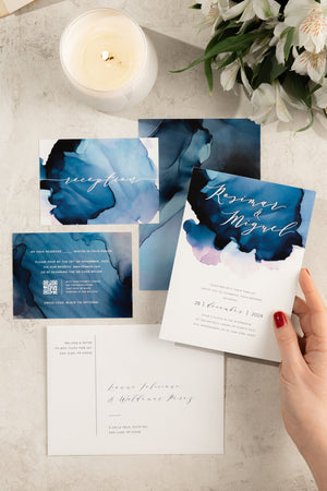 Abstract ocean-inspired watercolor wedding invitation suite with customizable ombre watercolor background in soft blues and sea tones.