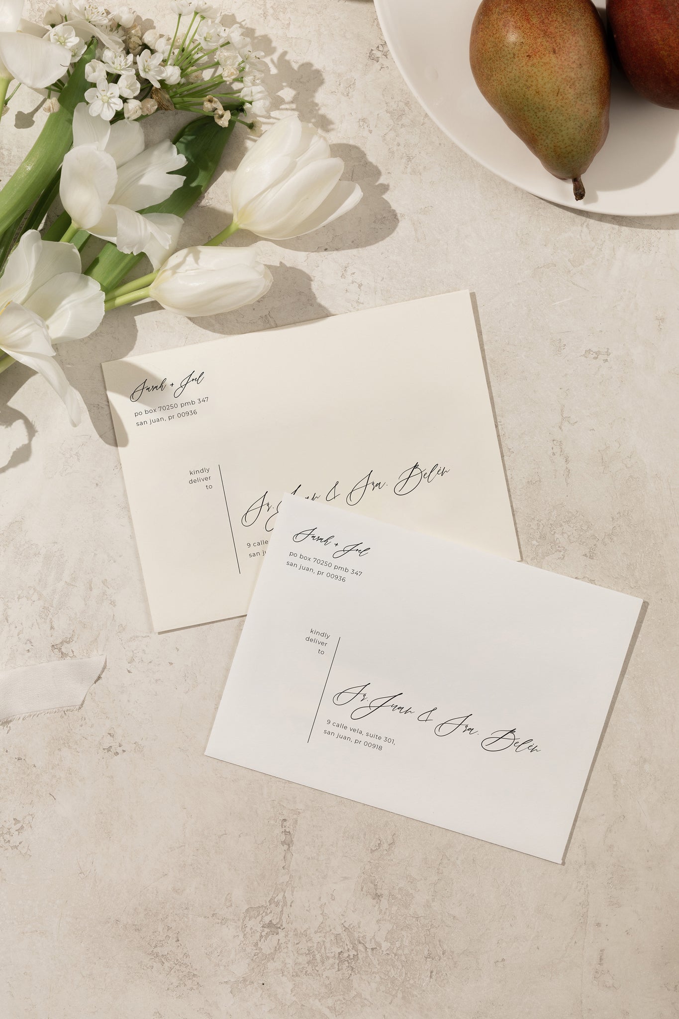 White and Ivory Printed envelopes for wedding invitation suite with minimalistic and easy to read script font for a unique and modern look.