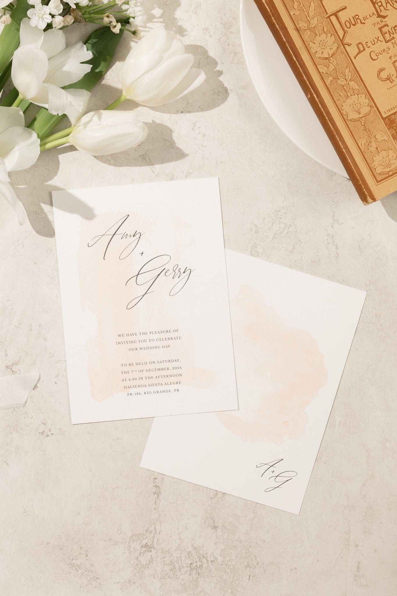 Minimal and romantic, front and back wedding invitation with a subtle ombre watercolor design in delicate, soft tones.