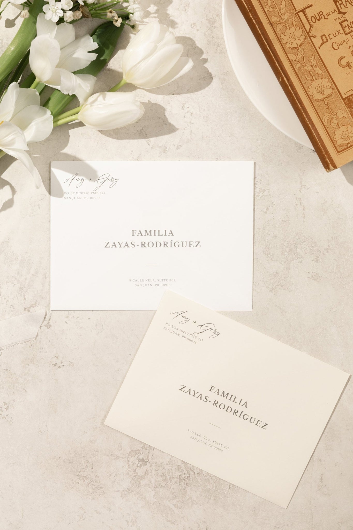 Minimal and romantic wedding printed envelopes, in white and ivory colors, with a subtle and minimal design.