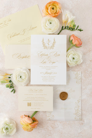 Sophisticated wedding invitation suite featuring a monogram inspired by bridal gown details, with a hand-drawn font created by our art director.